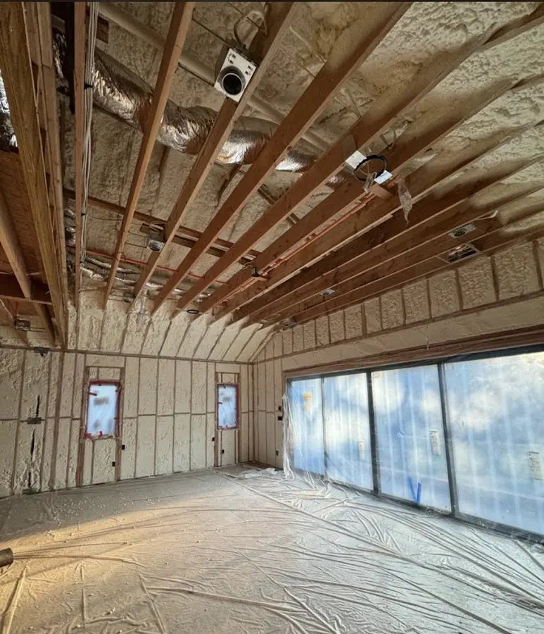 Interior walls and ceiling insulated with spray foam during new construction in Fairmount